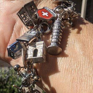 Sterling Silver Charm Bracelet 27 Sterling Charms Travel 64.8 Grams 7.5" Vintage